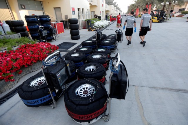 Tyres in blankets are lined up in the paddock